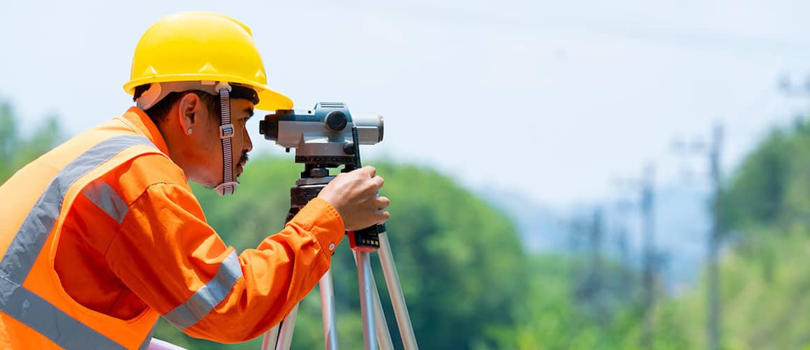 Building The Perfect Log Home In Adelaide A Land Surveying Checklist   Land Surveyor Working In Field Copy 